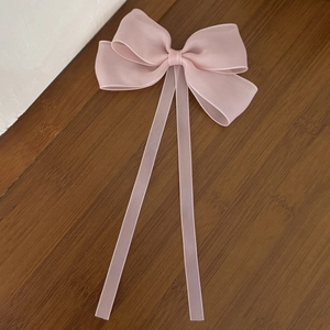 Pink sheer mesh bow hair clip with long ribbons for a sweet princess hair style
