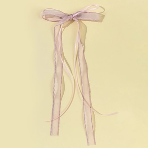 Pink ballet style organza ribbon bow hair clip with wavy edges for sweet hair styling