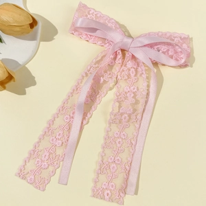 Elegant pink lace bow hair clip with double-layered floral texture and long ribbons