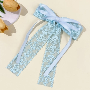 Elegant light blue lace bow hair clip with satin ribbons and French vintage style design