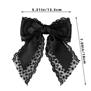 Detailed view of black lace bow hair clip with size dimensions 13.5cm x 18cm