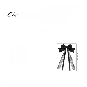 Detail of black lace bow hair clip with long ribbons and delicate splicing texture