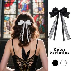 Elegant lace bow hair clip with long streamers in black and white styles for women