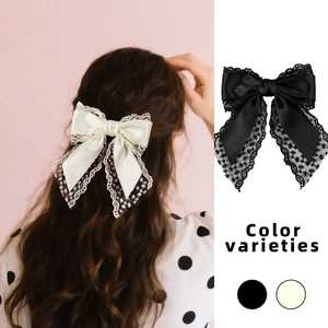 French lace bow hair clip in black and cream white with elegant satin layered design