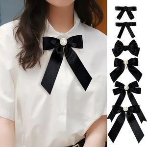 Elegant black satin ribbon bow brooch with pearl detail for academic style shirts