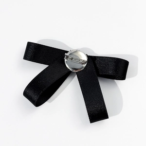 Elegant black satin bow brooch with pearl and silver safety pin clasp for women