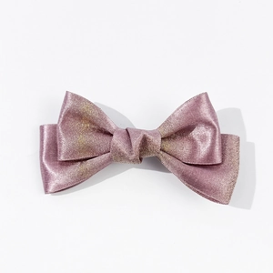Detailed top view of a shimmering pink purple bow hair clip with a metallic wire texture