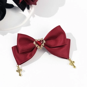 Gothic wine red bow hair clip with heart gem and golden cross pendants on white background