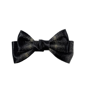 Elegant black bow hair clip with gold glitter finish, minimalist stylish hair accessory