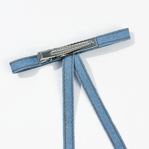 Blue denim fabric hair clip with yellow double stitching on a silver metal duckbill base