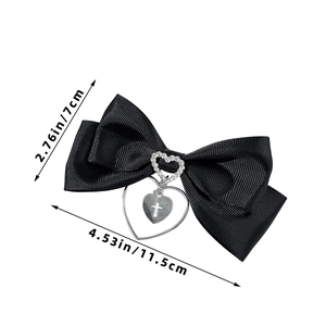 Detail showing dimensions of the black bow hair clip with heart and cross pendant