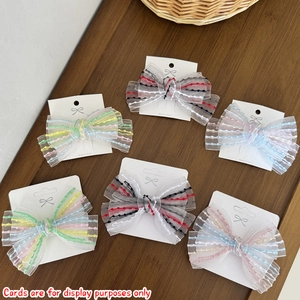 Detailed set of six striped organza bow hair clips displayed on a white product card
