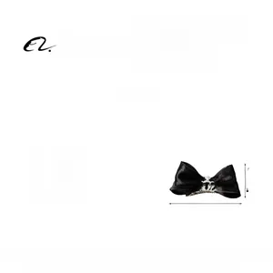 Detail showing solid black satin bow hair clip with silver crown rhinestone 10x5cm