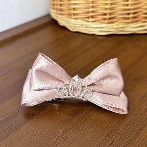 Pink satin bow hair clip for girls featuring a silver rhinestone crown center decoration