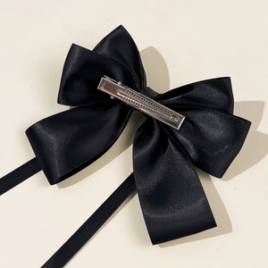 Elegant black satin bow hair clip with long ribbons and metal duckbill clip for women
