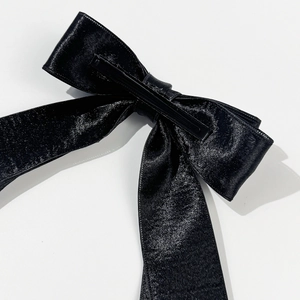 Elegant black silk satin bow hair clip with a metallic duckbill clamp for women