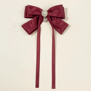 Elegant burgundy red bow hair clip with satin ribbons and dangling pearl pendant