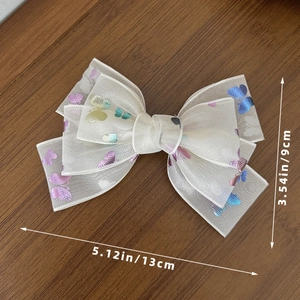White tulle bow hair clip with colorful butterfly patterns and size dimensions