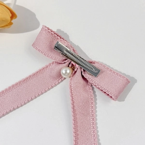 Elegant pink ribbon bow hair clip with white pearl pendant and silver metal duckbill clip