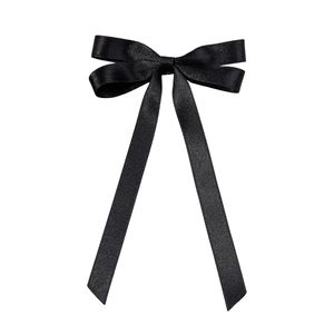 Elegant black satin bow hair clip with long ribbons for ballet style hair styling