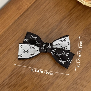 Pince à cheveux nœud à volants bicolore noir et blanc avec dimensions