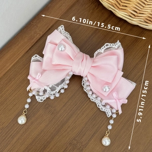 Barrette nœud Lolita rose avec dentelle, glands de perles et détails de mesure