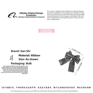 Detail view of silver ribbon bow hair clip showing 11x12cm size and metallic texture