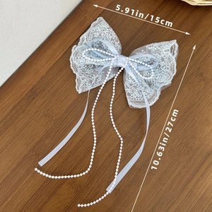 Fermaglio per capelli con fiocco in pizzo azzurro e lunghe catene di perle eleganti