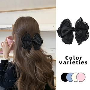 Black lace bow hair clip for women featuring elegant satin finish and delicate lace edges