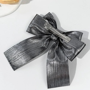 Sparkling bow hair clip with metallic texture and silver metal alligator clip base
