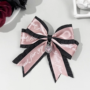 Pink and black Lolita bow hair clip with heart crystal and ruffled ribbon detail