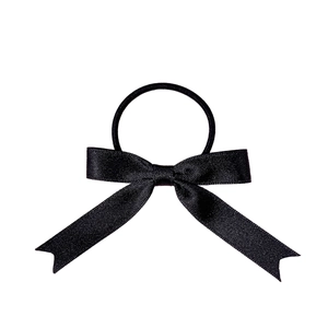 Elegant black satin long tail bow hair scrunchie for women with silk finish on white background
