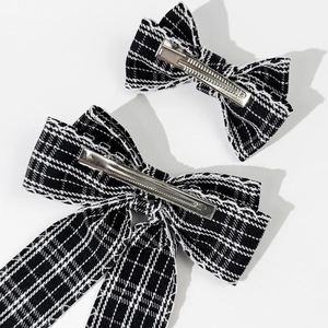 Set of two black and white plaid bow hair clips with metal crocodile clips for women