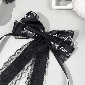 Barrette à cheveux avec nœud en dentelle noire et lettrage blanc élégant