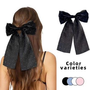 Elegant oversized fabric bow hair clip with rhinestones in black, blue, white, and pink