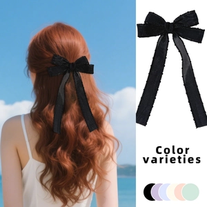 Mesh bow hair clip with long ribbons for girls, featuring elegant black flowing fabric