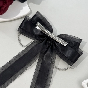 Elegant black satin bow hair clip with silver heart chain tassels and metal duckbill clip
