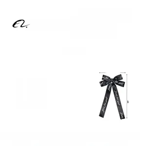 Détail de la pince à cheveux nœud noir avec ruban Just for you, dimensions 13,5x23cm