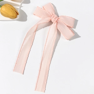 Pink chiffon mesh bow hair clip with long ribbons and wavy edges for women and girls