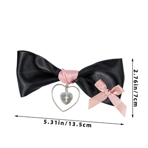 Detail of gothic black satin bow hair clip with heart cross pendant and size info