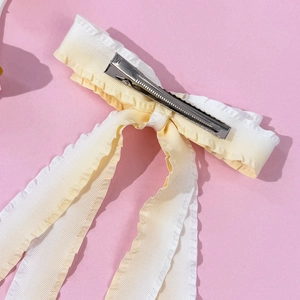 Dual-tone candy color bow hair clip with long ribbons and wavy cream pleated fabric