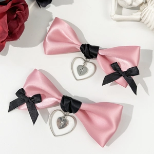 Pink and black Lolita hair clips with satin bow, heart charm and cross pendant