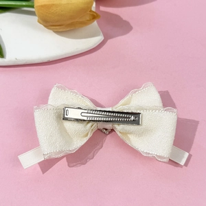Elegant cream ballet bow hair clip with lace trim and silver metal duckbill clamp