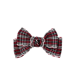 Classic red and black houndstooth hair bow clip with white lace trim in retro style