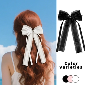 Barrette élégante avec cœur en strass et nœud en résille avec de longs rubans