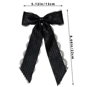 Detail view of large black lace bow tie with long ribbons and size measurements