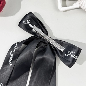 Elegant black layered satin bow hair clip with white Just for you lettered streamers