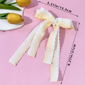 Pastel cream bow hair clip with long ribbons and ruffled edges, 13.5x21cm size guide