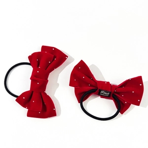 Elegant set of two red velvet bow hair ties with pearl beads and handmade label