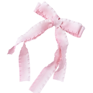 Pink bow hair clip with ribbed texture and ruffled edges for women's hair styling